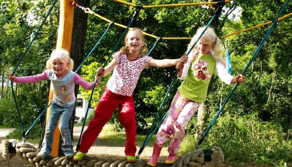children playing climbing rope playground geversduin